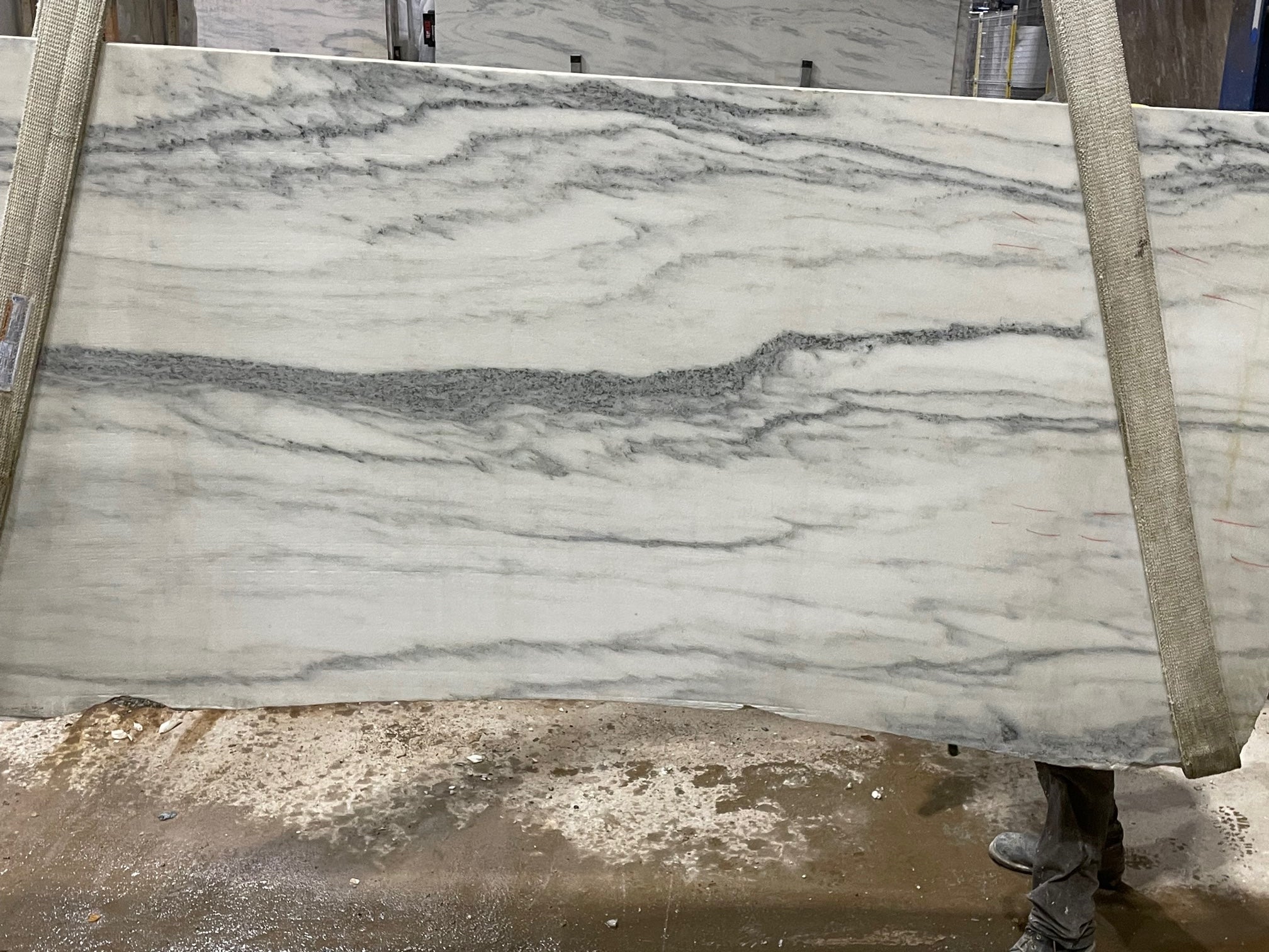 White marble slab with gray veining selected before fabrication